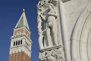 Images Dated 13th March 2005: Italy, Venice. Corner statue of Doges Palace and Campanile