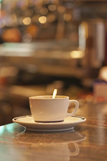 Italy, Venice. A cup of coffee and surrounding ambience of a cafe Italy, Venice. A cup of coffee and surrounding ambience of a cafe