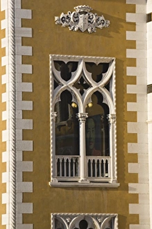 Italy, Venice. Window of Palazzo Cavalli-Franchetti with image of chairman inside Italy, Venice. Window of Palazzo Cavalli-Franchetti with image of chairman inside