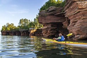 Kayaking Gallery: Kayaker exploring the sea caves of Devils Island in the Apostle Islands National Lakeshore