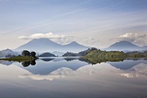 Lake Mutanda near Kisoro with the Virunga Vulcanoes as reflection in the lake Lake Mutanda near Kisoro with the Virunga Vulcanoes as reflection in the lake