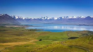 Lake Tekapo and the Southern Alps from the summit of Mt. John, Canterbury, South Island Lake Tekapo and the Southern Alps from the summit of Mt. John, Canterbury, South Island