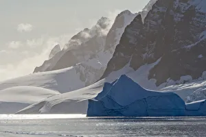 Landscape of snow covered island with iceberg in South Atlantic Ocean, Antarctica Landscape of snow covered island with iceberg in South Atlantic Ocean, Antarctica