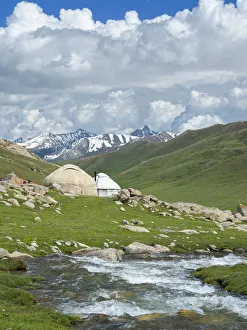 Landscape with Yurt at the Otmok mountain pass in the Tien Shan or heavenly mountains Landscape with Yurt at the Otmok mountain pass in the Tien Shan or heavenly mountains
