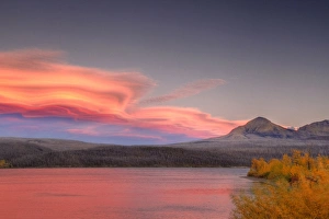 Lenticular clouds form over Divide Mountain and St Mary Lake in Glacier National Park Lenticular clouds form over Divide Mountain and St Mary Lake in Glacier National Park