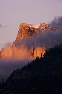 Last light falls on Half Dome as the sunsets - Yosemite National Park, California Last light falls on Half Dome as the sunsets - Yosemite National Park, California