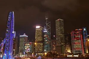 Light show on skyscrapers, and Hong Kong Observation Wheel, Central, Hong Kong Island Light show on skyscrapers, and Hong Kong Observation Wheel, Central, Hong Kong Island