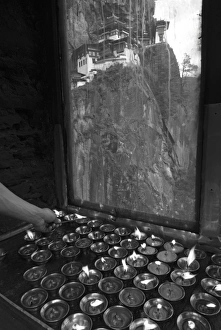 lighting candles at Taksang Monastery near Paro, Bhutan lighting candles at Taksang Monastery near Paro, Bhutan