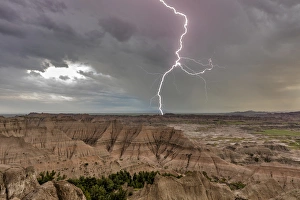 Lightning strike during thunderstorm from the Pinnacles Overlook in Badlands National Park Lightning strike during thunderstorm from the Pinnacles Overlook in Badlands National Park