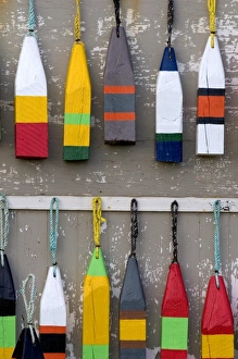 Lobster buoys hang on a wall at a village north of North Rustico on Prince Edward Island Lobster buoys hang on a wall at a village north of North Rustico on Prince Edward Island