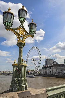 The London Eye and iconic British lamppost in London, England The London Eye and iconic British lamppost in London, England