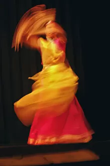 Swirling Gallery: Long exposure, slow motion effect on tradiitional dancer, New Delhi, India