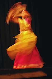 Long exposure, slow motion effect on tradiitional dancer, New Delhi, India Long exposure, slow motion effect on tradiitional dancer, New Delhi, India