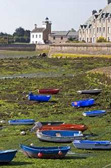 Low tide in the harbor at the village of Barfleur in the region of Basse-Normandie Low tide in the harbor at the village of Barfleur in the region of Basse-Normandie
