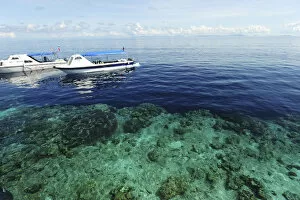 Images Dated 8th June 2010: Malaysia, Borneo, Semporna Archipelago, Sipadan, diving boat arriving above transparent sea