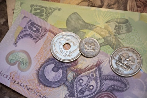 Melanesia, Papua New Guinea. Village of Vanimo. Colorful PNG money, the Kina, five Kina Melanesia, Papua New Guinea. Village of Vanimo. Colorful PNG money, the Kina, five Kina