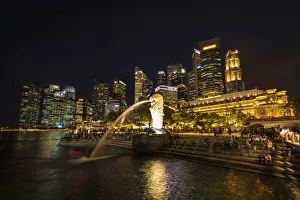 Merlion fountain and business district at night, Singapore Merlion fountain and business district at night, Singapore
