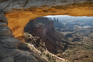 Mesa Arch reflected golden sunrise light, Island in the sky district Mesa Arch reflected golden sunrise light, Island in the sky district