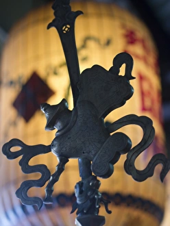 Metal icon in a Buddhist temple in Hoi An, Vietnam Metal icon in a Buddhist temple in Hoi An, Vietnam