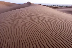 Morocco. Sunrise over Erg Chegaga (or Chigaga) is a Saharan sand dune (approximately Morocco. Sunrise over Erg Chegaga (or Chigaga) is a Saharan sand dune (approximately