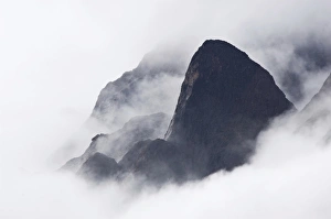 Mountain peaks in fog Prins Christian Sund Greenland Mountain peaks in fog Prins Christian Sund Greenland