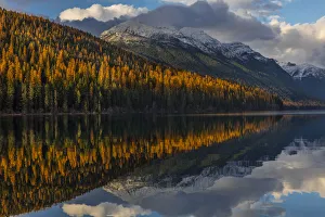 Mountain peaks reflect into Bowman Lake in autumn in Glacier National Park, Montana, USA Mountain peaks reflect into Bowman Lake in autumn in Glacier National Park, Montana, USA