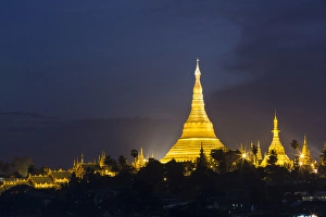 Myanmar, Yangon. Schwedagon Pagoda glows at twilight Myanmar, Yangon. Schwedagon Pagoda glows at twilight