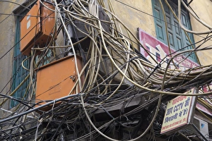 New Delhi, mass of wires for electronics and telecommunications strung between businesses New Delhi, mass of wires for electronics and telecommunications strung between businesses