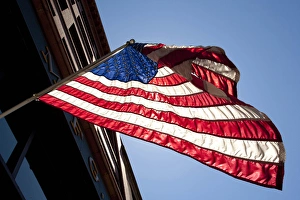 North America, Washington, Seattle, Pioneer Square neighborhood, American flag backlit North America, Washington, Seattle, Pioneer Square neighborhood, American flag backlit