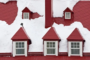 Old houses, red roof and window covered with snow, Quebec City, Canada Old houses, red roof and window covered with snow, Quebec City, Canada