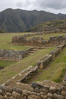 Old Inca walls surround field with mountain in distance, Chinchero (near Cuzco), Peru Old Inca walls surround field with mountain in distance, Chinchero (near Cuzco), Peru