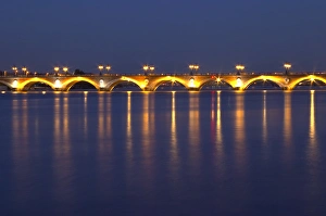 The old Pont de Pierre bridgeat night with reflections in Bordeaux on the Garonne River The old Pont de Pierre bridgeat night with reflections in Bordeaux on the Garonne River