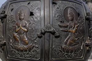 The ornate, engraved bronze doors to the outdoor incense burner of the Daibutsu, Kamakura The ornate, engraved bronze doors to the outdoor incense burner of the Daibutsu, Kamakura