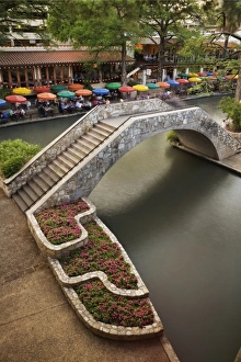 Outdoor cafe along River Walk and bridge over San Antonio River, San Antonio, Texas Outdoor cafe along River Walk and bridge over San Antonio River, San Antonio, Texas