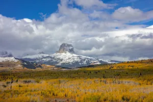 Peak fall color in aspen groves below Chief Mountain in Glacier National Park, Montana Peak fall color in aspen groves below Chief Mountain in Glacier National Park, Montana