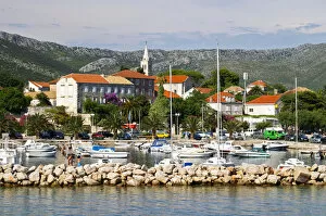 The pleasure boat harbour and the village. Orebic town, holiday resort on the south