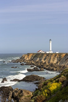 Point Arena lighthouse on cliffs over the Pacific Ocean near Point Arena, California, USA Point Arena lighthouse on cliffs over the Pacific Ocean near Point Arena, California, USA