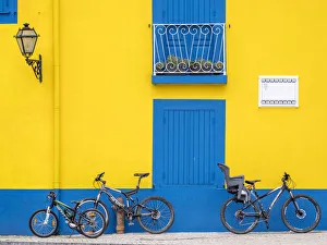 Portugal, Aveiro. Yellow house with blue shutters, windows and doors in the city of Aveiro Portugal, Aveiro. Yellow house with blue shutters, windows and doors in the city of Aveiro