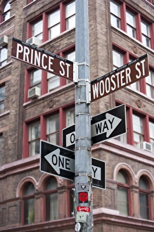 Prince Street and Wooster street signs in the Cast Iron HIstorical district of SoHo Prince Street and Wooster street signs in the Cast Iron HIstorical district of SoHo