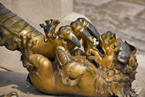 A Qing-era guardian lion with paw on baby lion, Forbidden City; Beijing; China, Asia A Qing-era guardian lion with paw on baby lion, Forbidden City; Beijing; China, Asia