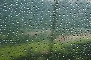 Rain drops on a cable car going up the mountains in the Bavarian Alps Rain drops on a cable car going up the mountains in the Bavarian Alps