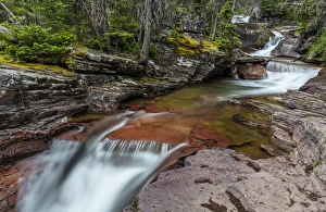Red rocked Virginia Creek in Glacier National Park, Montana, USA Red rocked Virginia Creek in Glacier National Park, Montana, USA