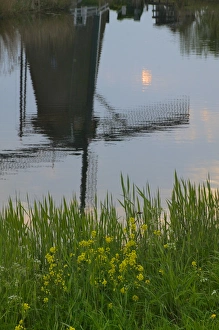 Reflection of windmills in the water along the canal in Kinderdijk, Netherlands Reflection of windmills in the water along the canal in Kinderdijk, Netherlands