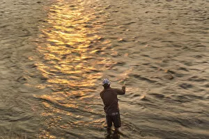 Images Dated 12th August 2012: Reid Sabin fly fishing at sunrise on the Madison river near Ennis, Montana, USA (MR)