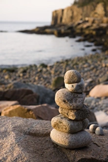 A rock cairn on the cobblestone beach in Momument Cove in Maines Acadia National Park A rock cairn on the cobblestone beach in Momument Cove in Maines Acadia National Park