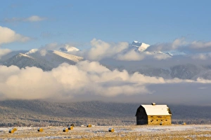 Rustic barn and hay bales after a fresh snow in the Mission Valley of Montana Rustic barn and hay bales after a fresh snow in the Mission Valley of Montana