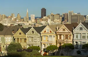 San Francisco California Painted Ladies Victorian homes and city in background at San Francisco California Painted Ladies Victorian homes and city in background at