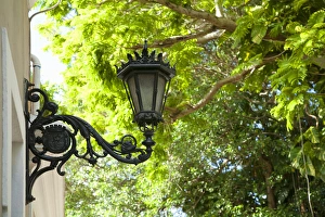 San Juan, Puerto Rico - A Spanish Colonial style ornate lam is mounted on the exterior San Juan, Puerto Rico - A Spanish Colonial style ornate lam is mounted on the exterior