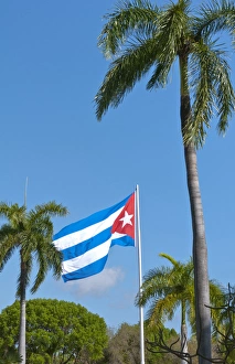 Santiago Cuba Cuban flag flying at Santa Ifigenia Cemetery and mausoleum of Jose Marti Santiago Cuba Cuban flag flying at Santa Ifigenia Cemetery and mausoleum of Jose Marti