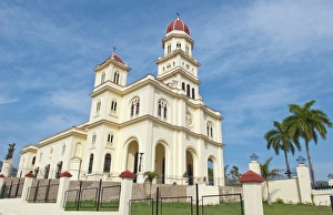 Santiago Cuba famous church called Basilica El Cabre with steeple and green grass Santiago Cuba famous church called Basilica El Cabre with steeple and green grass